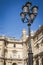 Architectural facade of the aisles and the lamps of the place of the pyramids of the Louvre museum in Paris