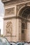 Architectural fragment of Arc de Triomphe. Arc de Triomphe de l\\\'Etoile on Charles de Gaulle Place is one of the most famous