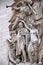 Architectural fragment of Arc de Triomphe du Carrousel, under sky with clouds in Paris.