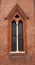 Architectural fragment. Gothic window. Church of San Gotardo in Milan, Italy. Architect Francesco Pecorari from Cremona