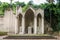 Architectural history imperial altar among the greenery entwined with ivy in the capital of Italy, Rome