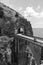 Architectural landmark, stone bridge. A view of the Fiordo of Furore in Amalfi coast, Motorcyclist on road. Travel and vacation