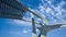 Architectural sculptures against a blue sky with dramatic clouds