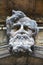 Architectural stone male head statue in Venice, Italy