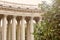 Architectural view of the colonnade of the Kazan Cathedral.Garden of green trees. Saint Petersburg, Russia