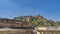 The architecture of Amber Fort. Sandstone walls, towers with domes, arches, columns