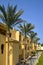 Architecture of buildings is in Arabic style. An arch windows in wall of arabic building. Picturesque courtyard of hotel.