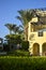 Architecture of buildings is in Arabic style. An arch windows in wall of arabic building. Picturesque courtyard of hotel.