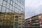 Architecture buildings background with new glass facade, old blocks and reflection