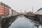 Architecture and buildings of the streets of Copenhagen featuring frozen canals with ice blocks in the water