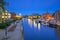 Architecture of Bydgoszcz city with reflection in Brda river at night