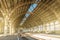 Architecture curved arches, metal struts and glass roof, interior details at empty train station