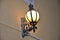 Architecture detail with street lamp. Graceful beauty of a usual street lantern.