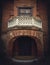 Architecture details, the front door with the balcony of the Hunting Castle at Manuc Bei mansion, Moldova. Old brick building