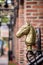 Architecture details- vintage brass horse head adorns the entrance of a brick building in Downtown Alexandria VA