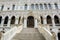 The architecture of the Doge`s Palace from the courtyard: stairs and sculptures, Venice, Italy