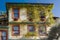 The architecture of Kavala - a beautiful house with climbing plants in the old town. Greece.