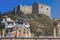 The architecture of Kavala under part of the Acropolis - fortress buildings and the fortress wall built into a rock. Greece.