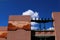 Architecture with southwestern design in stucco against blue sky with clouds, Santa Fe, New Mexico