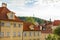 The architecture of the strago city of Prague. Multi-colored low buildings and stone paving stones. Streets of old Europe