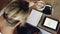 Architecture, tablet and woman with a notebook at a cafe working on a floor plan on digital screen for remote work