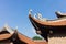 Architecture of top roof of Imperial Academy on fifth courtyard in Temple of Literature or Van Mieu in Hanoi, Vietnam