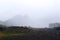 Archive photo, 2008: Dawning fog and cloud over Camel Mountain and tourist camp, Kamchatka Peninsula