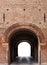 Archway in the ancient brick fortress wall