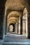 Archway, Columns, Courtyard and Cobblestones in Palace of Pilotta, Parma -Italy