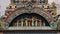 An archway containing statues of Indian religious figures