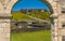 An archway framed view of Brimstone Hill Fort in St Kitts