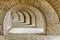 Archway with many stone arches, antique tunnel