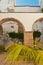 Archway of open courtyard of a vintage hotel