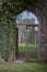 Archway with wooden gates at old abbey in Brecon Beacons in Wales