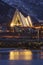 The arctic cathedral in Tromso reflected in the fjord.