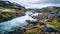 Arctic Lagoon: A Serene River Surrounded By Mountains And Moss