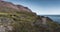 Arctic landscape of Disko Bay in Greeland in Summer. Blue Sky and green meadows. Arctic Circle Trail with temple