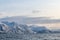 Arctic landscape in winter with snowy mountains and sea. Norwegian coasts and fjords seen from the boat in the open sea. Arctic