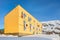 Arctic living residential house with snow hill in the background,  Ilulissat city, Greenland