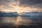 Arctic nature landscape with icebergs in Greenland icefjord with midnight sun sunset sunrise in the horizon. Early