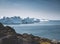 Arctic nature landscape with icebergs in Greenland icefjord with midnight sun sunset sunrise in the horizon. Early