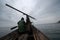 Arctic sea hunters hunt walruses and seals in the Bering Strait. Traditional Chukchi sea animal hunting using a harpoon.