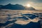 Arctic winter landscape with snow covered mountains at Kapp Ekholm, Svalbard, Norway, backlit