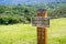 `Area closed Fragile Wildflower & Butterfly Habitat; Do Not Enter` sign