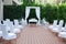 Area of the Wedding Ceremony, Decorated with White Flowers. Beautiful Arch, White Chairs Decorated with flowers