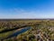Areal countryside view from drone with small river Venta