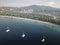 Areal view of Koukounaries beach at Skiathos and three sailboats