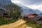 An areal view of a rural landscape lined with small, rustic houses: Sapa, Northern Vietnam