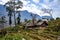 An areal view of a rural landscape lined with small, rustic houses: Sapa, Northern Vietnam