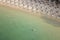 Areal view of sandy Koukounaries beach, turquoise sea, parasols and sunbeds